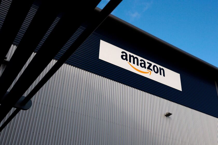 (FILES) This file photo taken on November 25, 2015 shows an Amazon logo hanging on a wall outside an Amazon.co.uk fulfillment centre in Hemel Hempstead, north of London. EU competition chief Margrethe Vestager on October 4, 2017 ordered Amazon to pay 250 million euros in back taxes linked to an "illegal tax break" that Luxembourg granted the internet shopping giant. "Luxembourg gave illegal tax benefits to Amazon. As a result, almost three quarters of Amazon's profits were not taxed," Vestager said in a statement. / AFP PHOTO / ADRIAN DENNISADRIAN DENNIS/AFP/Getty Images ** OUTS - ELSENT, FPG, CM - OUTS * NM, PH, VA if sourced by CT, LA or MoD **