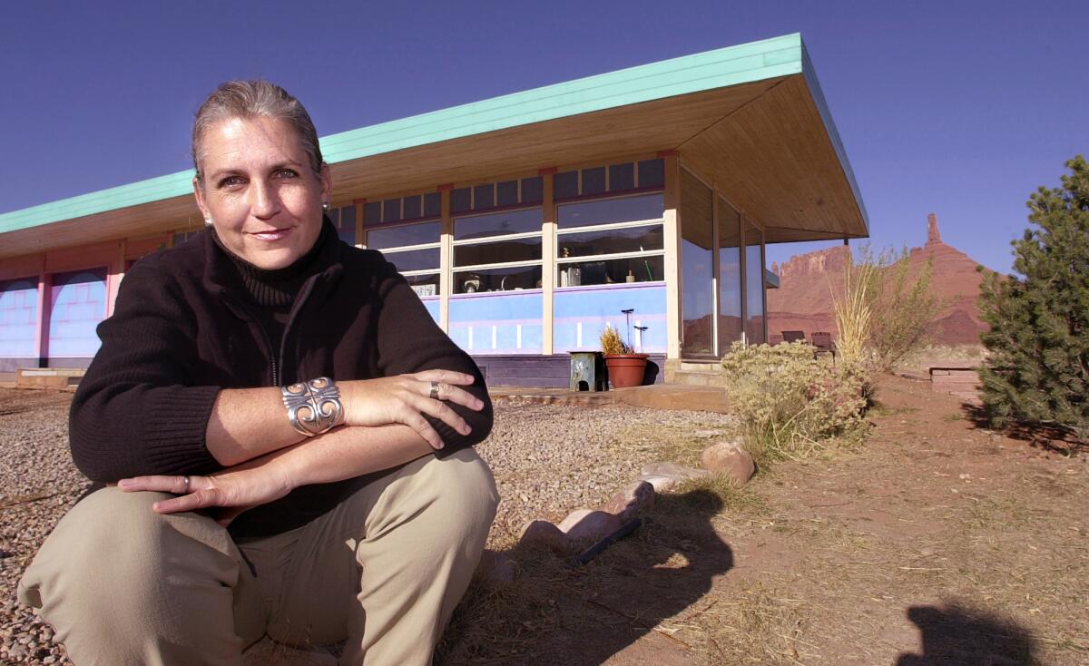 Terry Tempest Williams poses outside her Castle Valley, Utah, home in 2001. Living in a remote valley in Southern Utah, the naturalist author's love of the land defines her life.