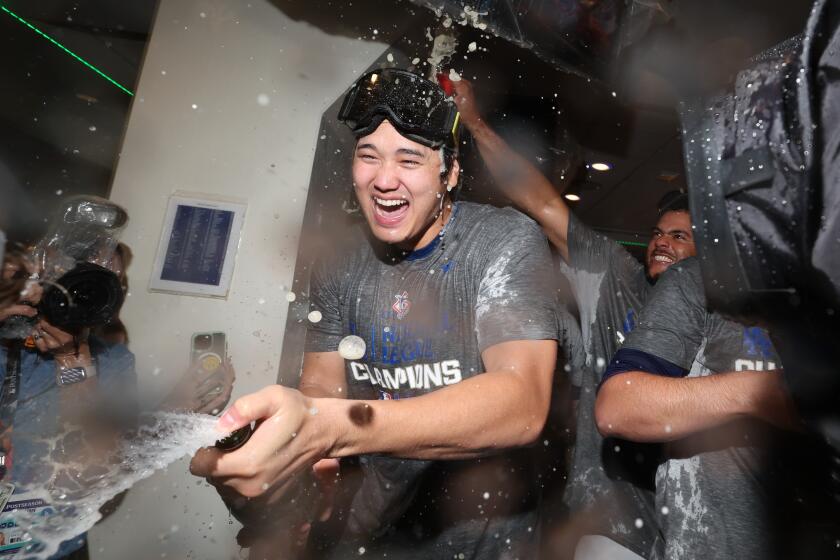 LOS ANGELES, CALIFORNIA - OCTOBER 20: Shohei Ohtani #17 of the Los Angeles Dodgers sprays.