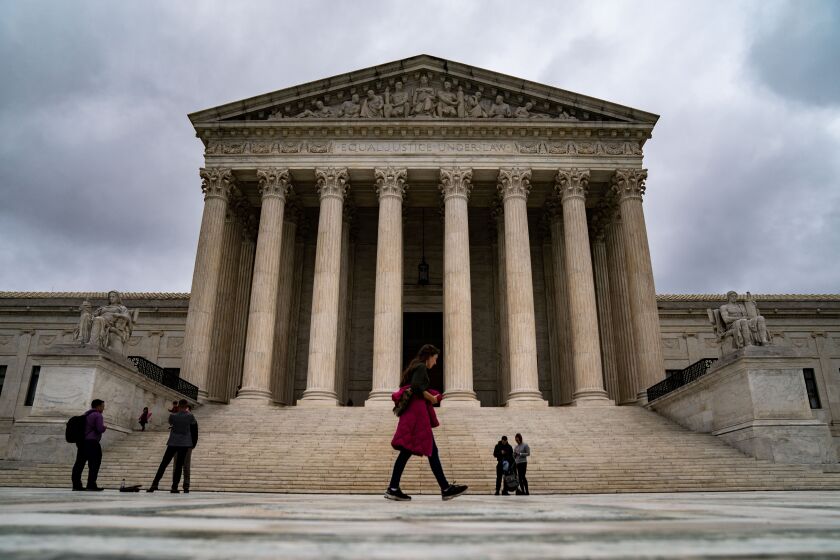 WASHINGTON, DC - OCTOBER 05: People visit the plaza in front of the Supreme Court of the United States on Wednesday, Oct. 5, 2022 in Washington, DC. (Kent Nishimura / Los Angeles Times)