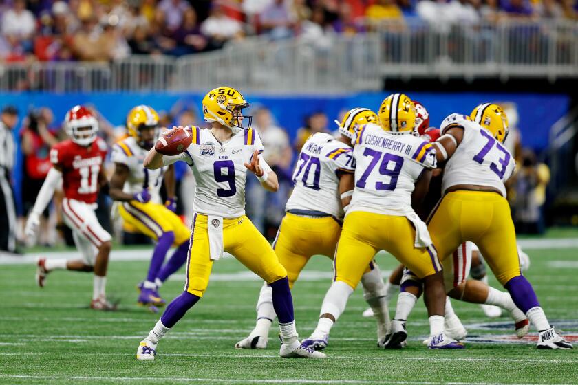 ATLANTA, GEORGIA - DECEMBER 28: Quarterback Joe Burrow #9 of the LSU Tigers delivers a pass against the defense of the Oklahoma Sooners during the Chick-fil-A Peach Bowl at Mercedes-Benz Stadium on December 28, 2019 in Atlanta, Georgia. (Photo by Mike Zarrilli/Getty Images)