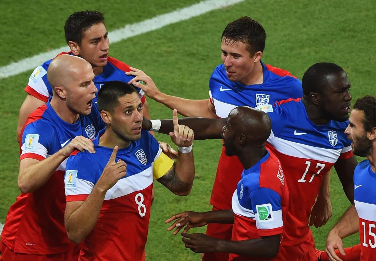 Clint Dempsey (8) celebrates with his teammates after scoring the United States' first goal of the World Cup in the first minute against Ghana.