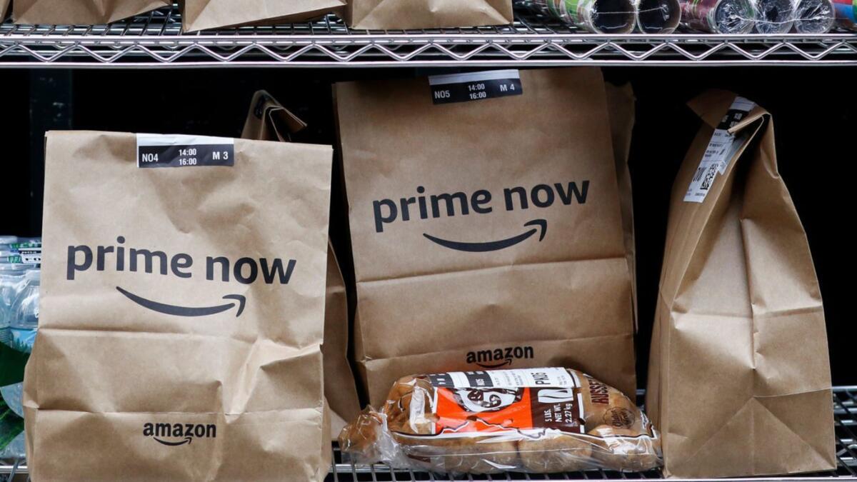 Amazon Prime Now bags sit ready for delivery at a warehouse in New York.