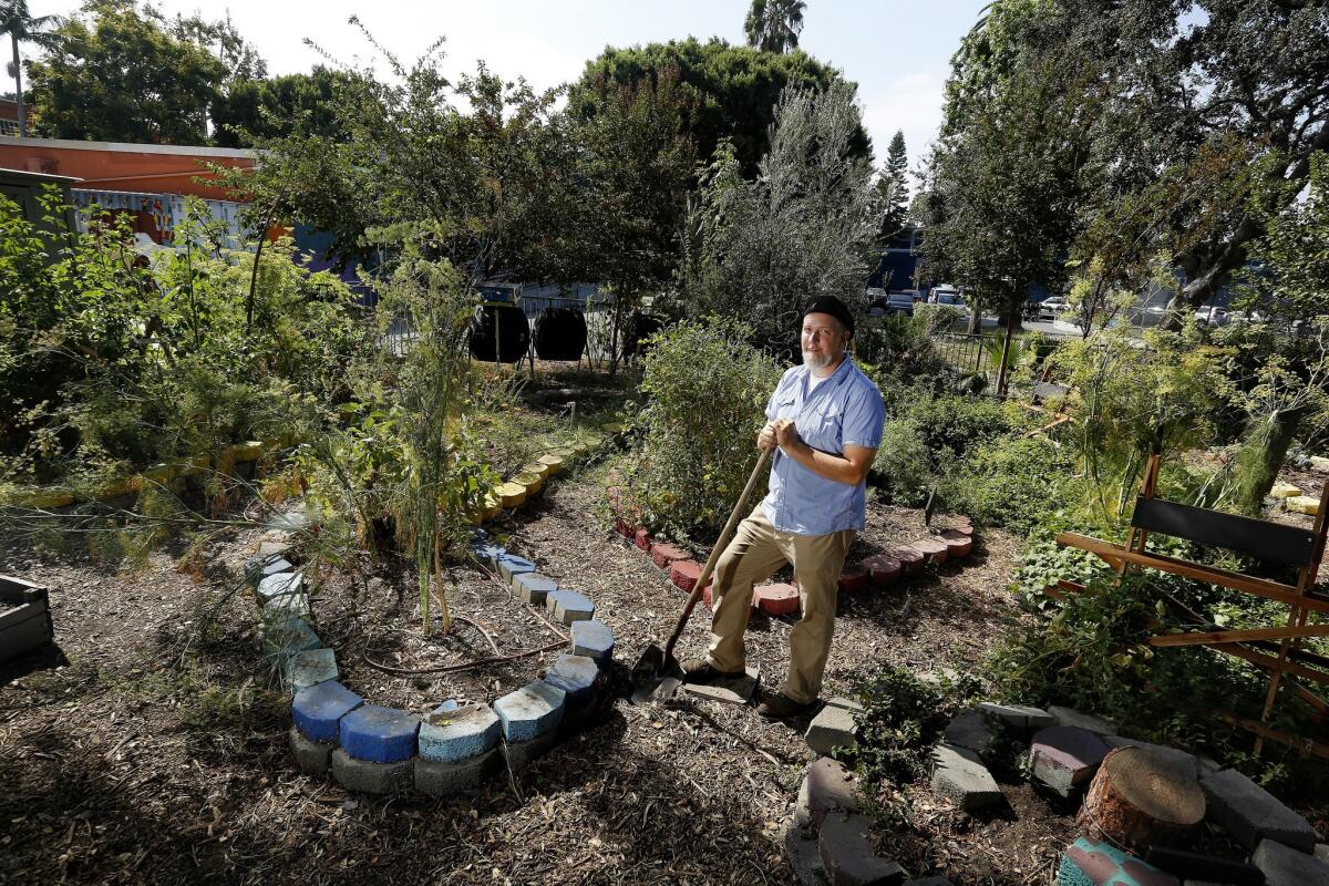 David Egeler, a teacher in the environmental studies magnet at Thomas Starr King Middle School, stands in the school's central garden on Aug. 31.