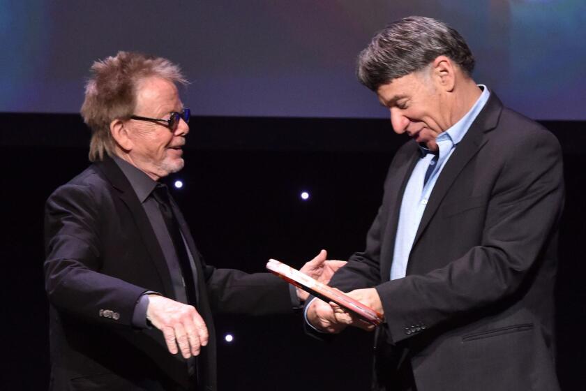 LOS ANGELES, CA - MAY 16: Honoree Stephen Schwartz accepts the Founder's Award from ASCAP President Paul Williams onstage at the 2017 ASCAP Screen Music Awards at The Wiltern on May 16, 2017 in Los Angeles, California. (Photo by Lester Cohen/Getty Images for ASCAP)