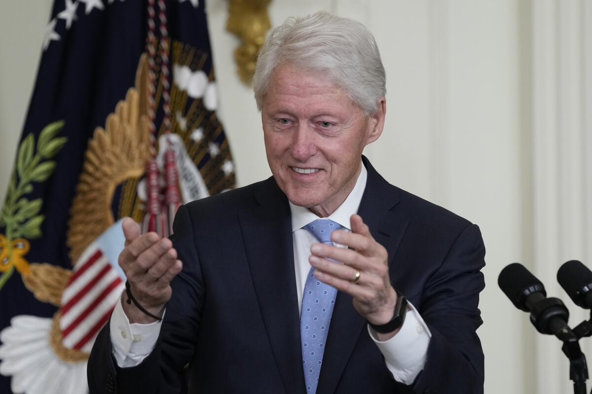 Former President Bill Clinton blows a kiss to someone in the audience as he speaks as President Joe Biden listens during an event in the East Room of the White House in Washington, Thursday, Feb. 2, 2023, to mark the 30thAnniversary of the Family and Medical Leave Act. (AP Photo/Susan Walsh)