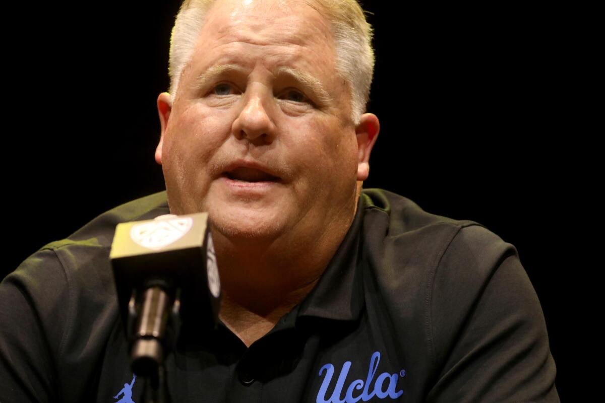 UCLA coach Chip Kelly answers a question during Pac-12 media day.