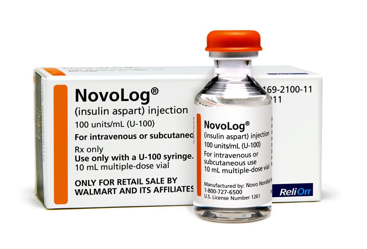 A bottle and package of insulin