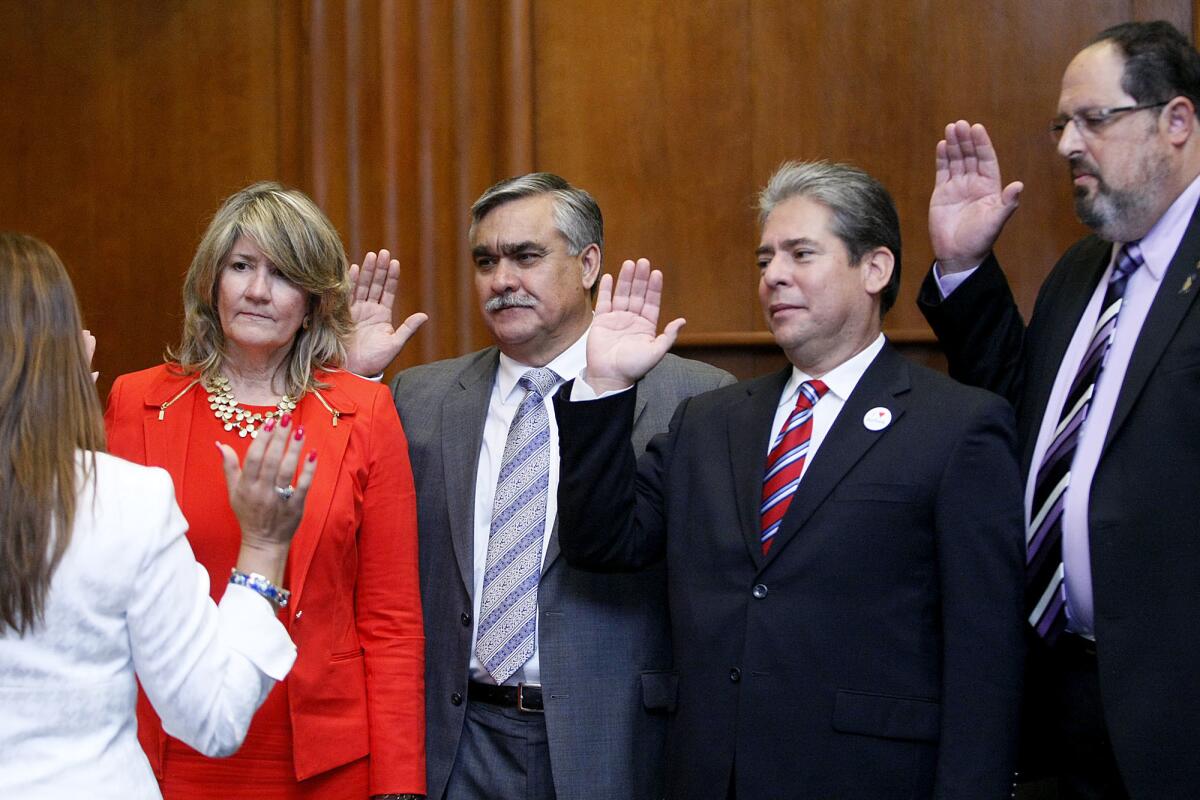 From left to right, Burbank City Treasurer Debbie Kutka and councilman Jess Talamantes, Bob Frutos and David Gordon are sworn into office in this file photo taken on Wednesday, May 1, 2013. All four are seeking reelection in 2017.