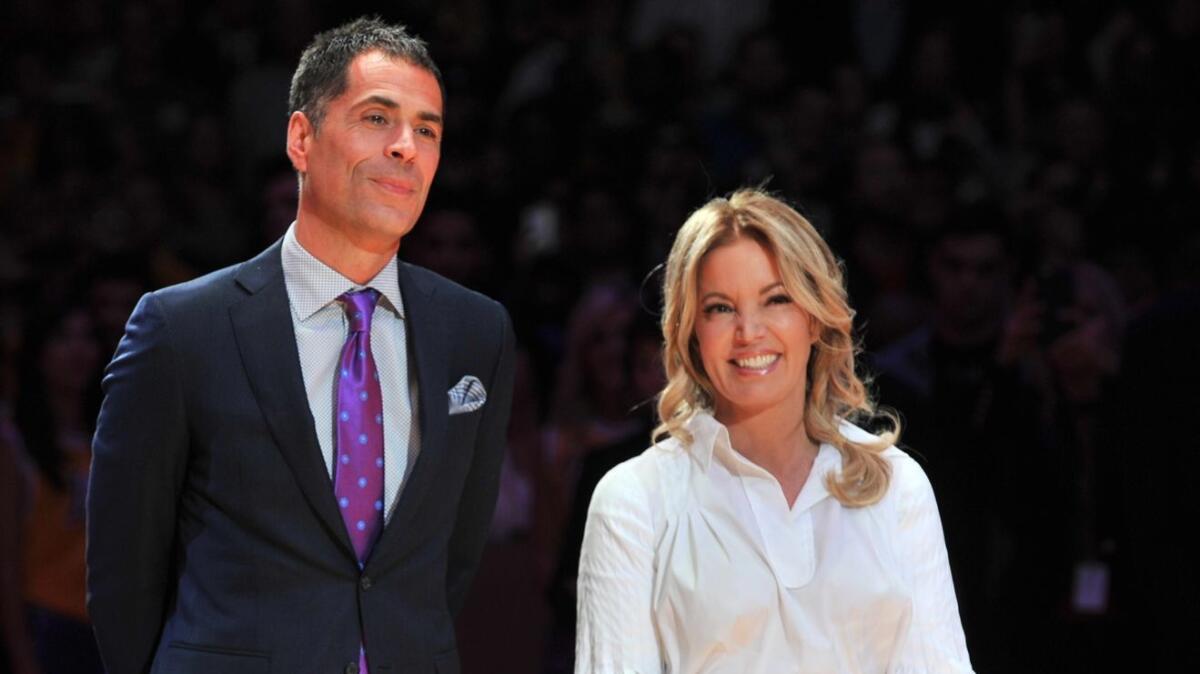Lakers general manager Rob Pelinka and owner Jeanie Buss attend Kobe Bryant's jersey retirement ceremony in December 2017. Buss says she's completely confident in Pelinka running the team.