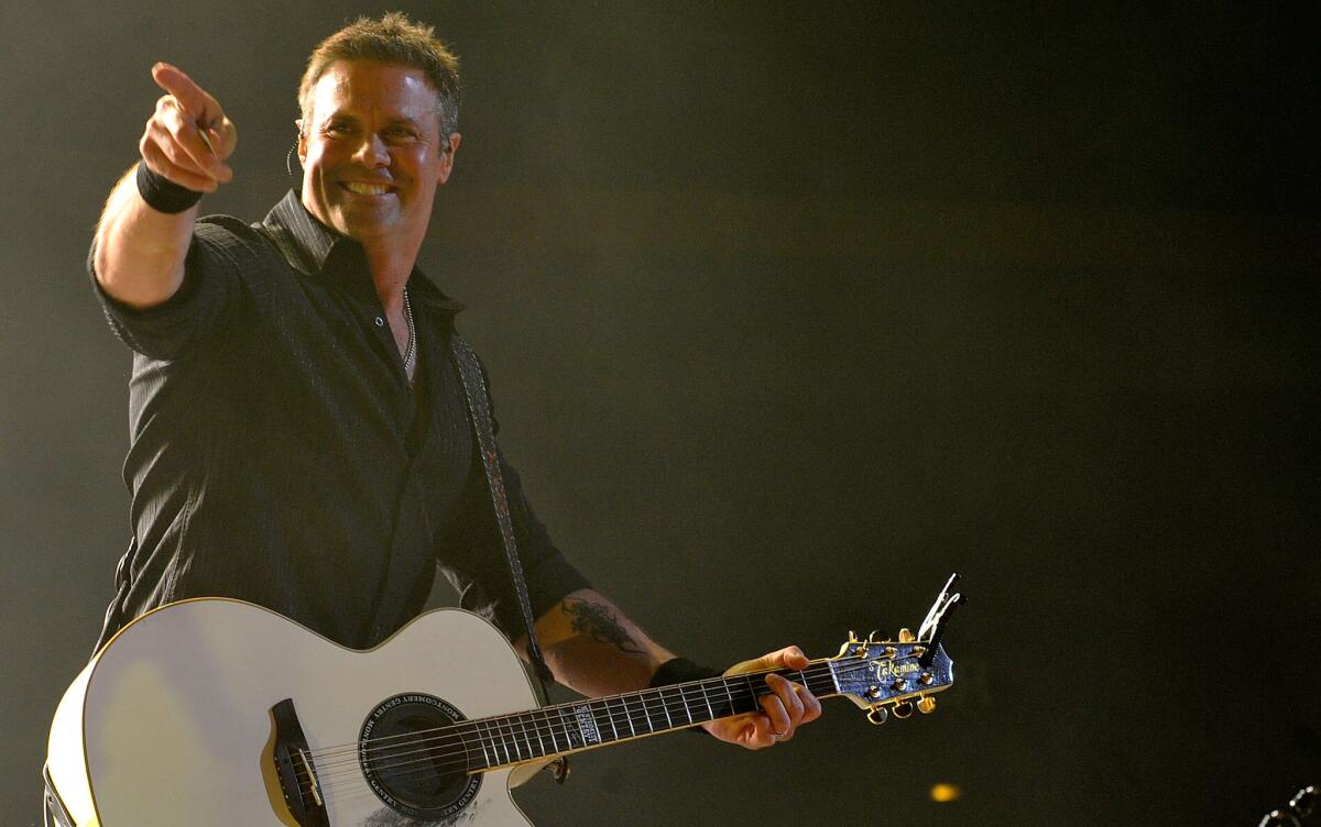Troy Gentry of music group Montgomery Gentry was killed in a helicopter crash Friday in Medford, N.J. He was 50.