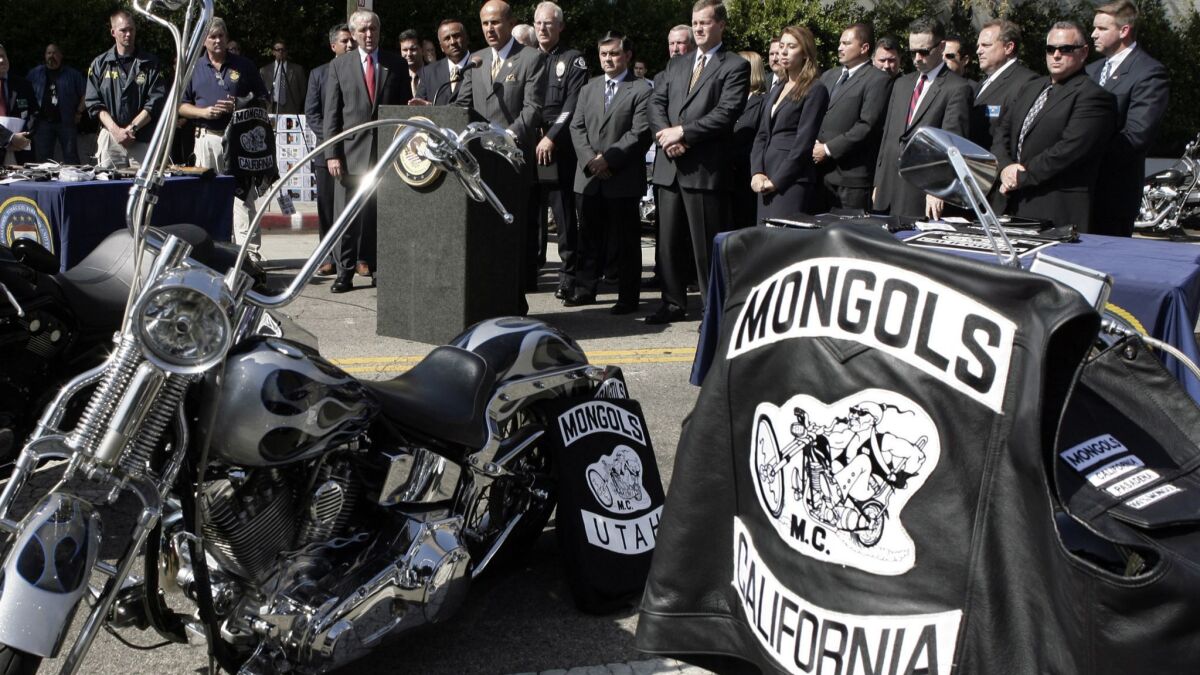 A vest with the trademarked Mongols logo is seen on a motorcycle.
