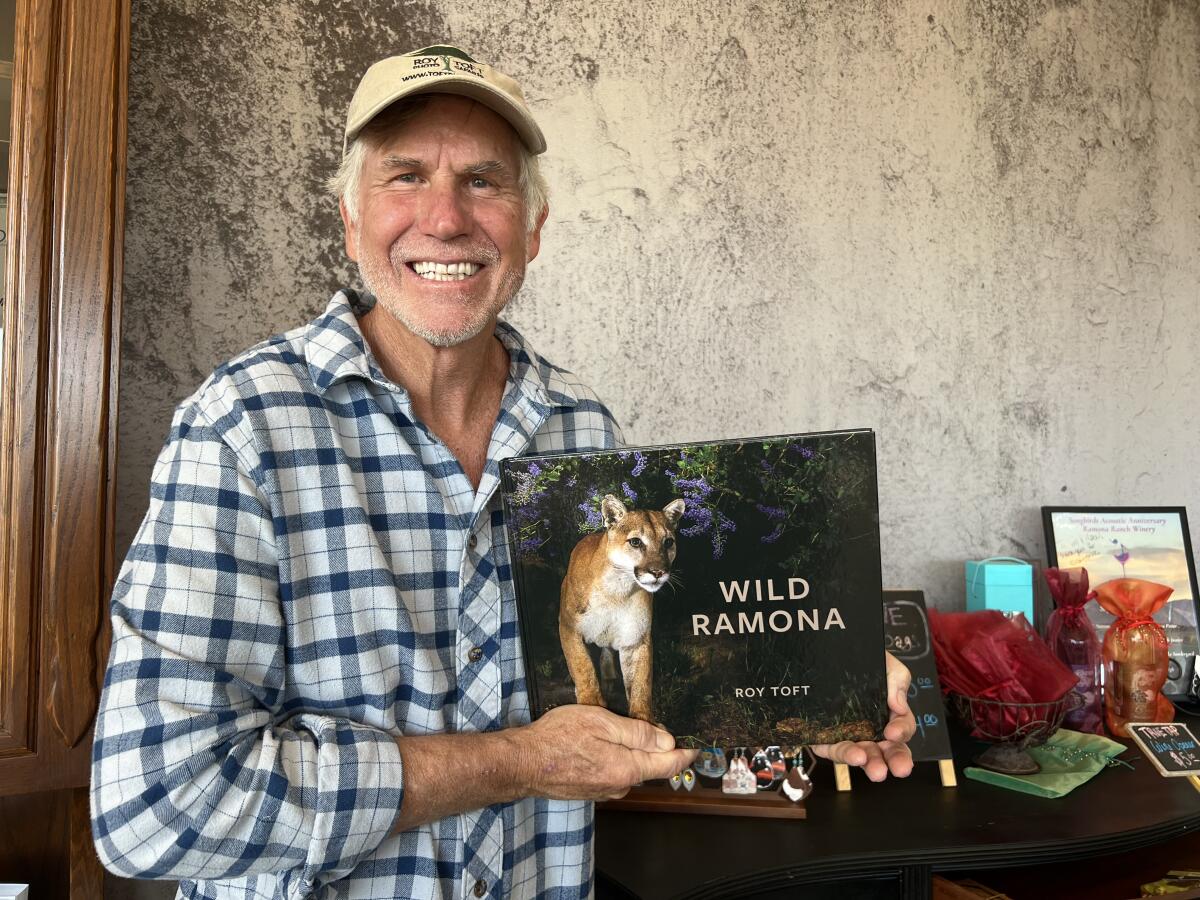 Award-winning wildlife photographer Roy Toft with his new book, “Wild Ramona.”
