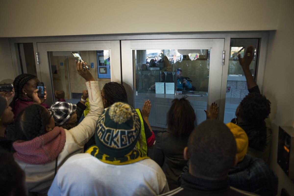 Protestors demanded entry to the 4th Precinct station Sunday in Minneapolis. Neighbors and community members gathered at the scene where a man was shot and wounded by a Minneapolis Police officer early Sunday morning.