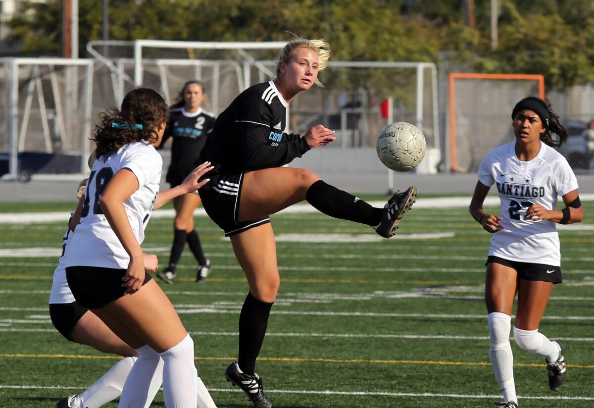 Corona del Mar's Nikki Senske (1) tries to get control of the ball during Saturday's CIF Southern Section Division 1 second-round match against Corona Santiago at Newport Harbor High.