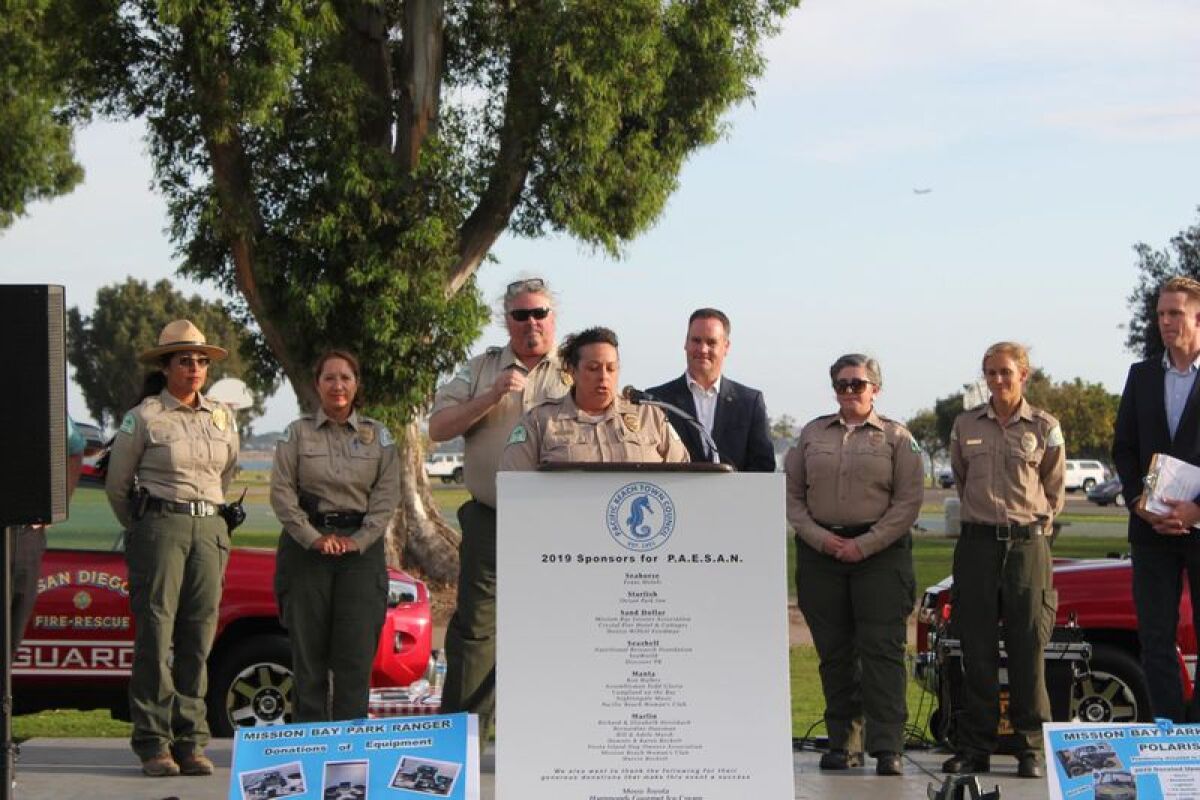 Senior Park Ranger Karolyn Estrada-Sparlin at podium with the Mission Bay Park rangers