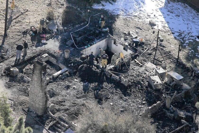 Investigators on Wednesday were tryng to identify the human remains found in the charred cabin where fugitive ex-LAPD Officer Christopher Dorner was believed to have been holed up after trading gunfire with officers near Big Bear, authorities said.