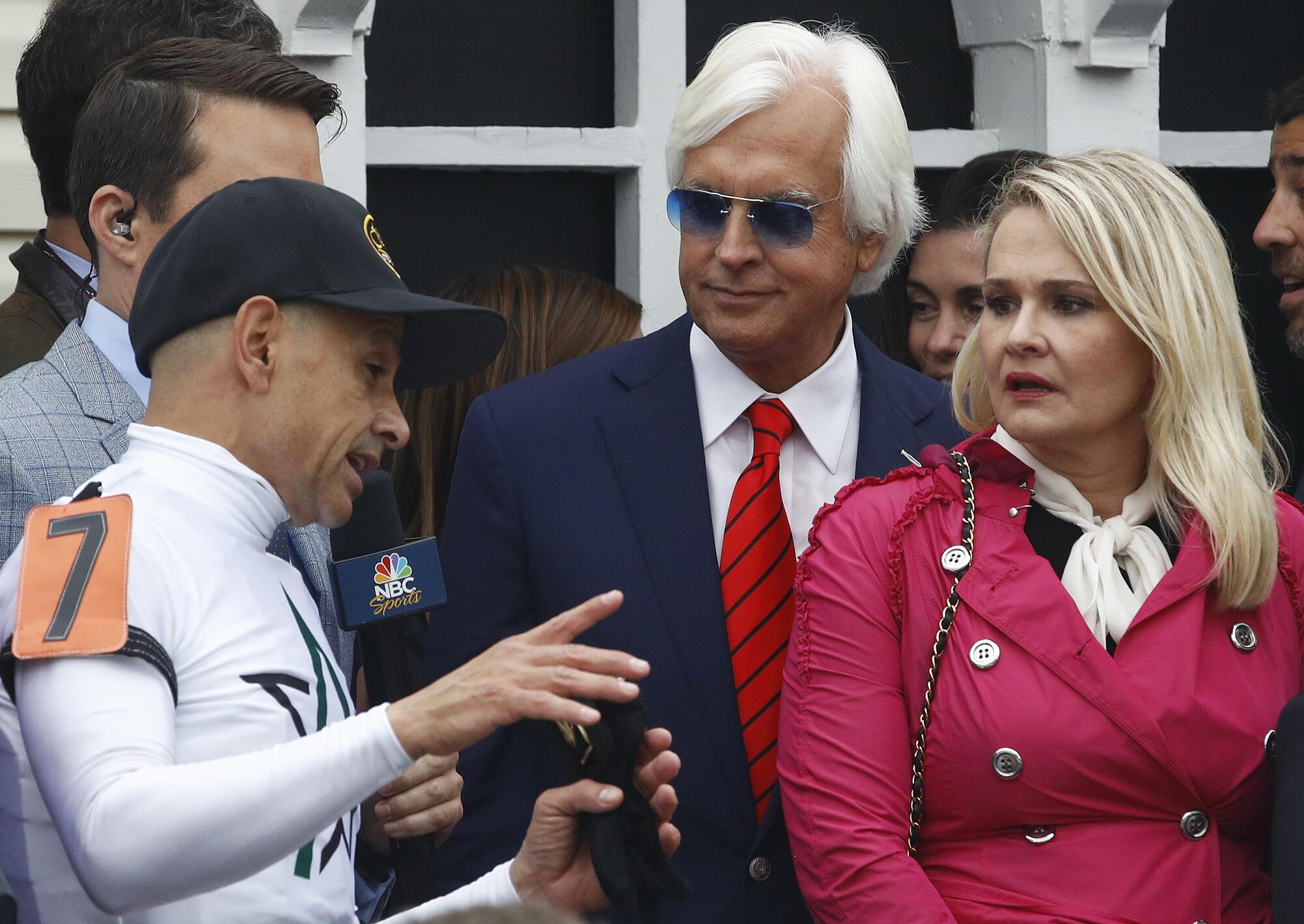Jockey Mike Smith speaks to Bob and Jill Baffert after guiding Justify to victory in the 143rd Preakness Stakes in 2018.