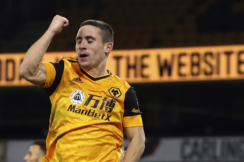 Wolverhampton Wanderers' Daniel Podence celebrates his goal against Chelsea during the English Premier League soccer match between Wolverhampton Wanderers and Chelsea at the Molineux Stadium in Wolverhampton, England, Tuesday, Dec. 15, 2020. (Michael Steele/Pool via AP)