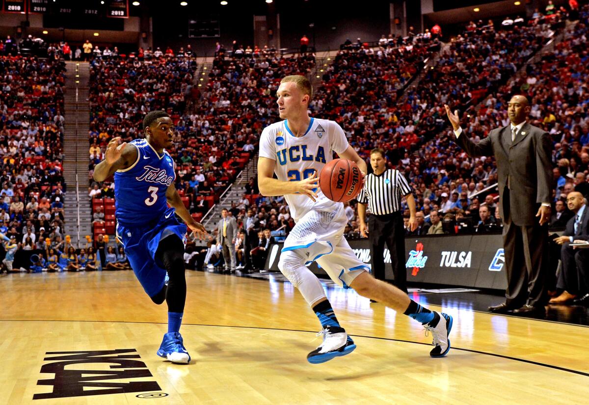 Bryce Alford drives against Rashad Ray of Tulsa. Coach Steve Alford has used Bryce, a freshman, as a spark off the bench.