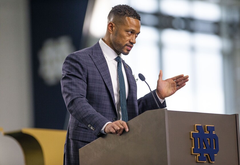 Marcus Freeman answers questions during a news conference Monday, Dec. 6, 2021 at the Irish Athletic Center in South Bend, Ind. Notre Dame formally introduced Freeman as its new football coach, a meteoric rise for the defensive coordinator. (Michael Caterina/South Bend Tribune via AP)