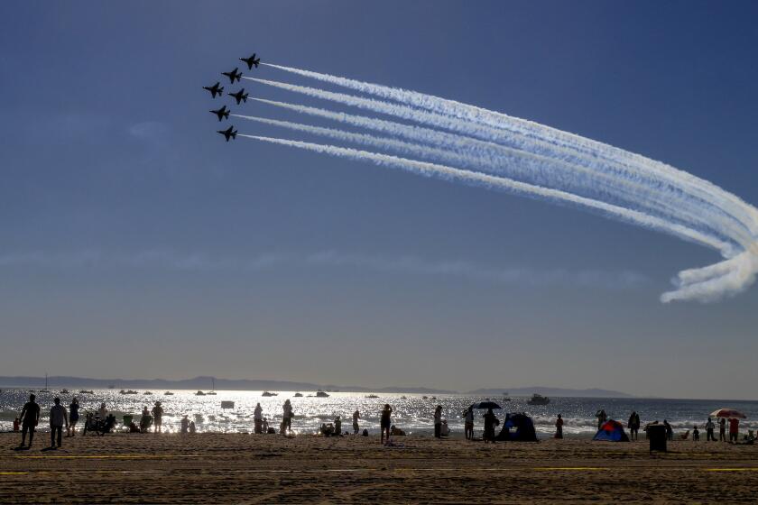 HUNTINGTON BEACH,CA--October 19, 2018: The USAF Thunderbirds take a practice run in the skies over Huntington Beach for the 3rd Annual Great Pacific Airshow Friday October 19, 2018. The practice day drew thousands of spectators lining the sands to see stunt planes belching smoke and the USAF Thunderbirds flying over a large swath of Huntington Beach along the coast from Seapoint to Beach Boulevard Mark Boster/For The Los Angeles Times