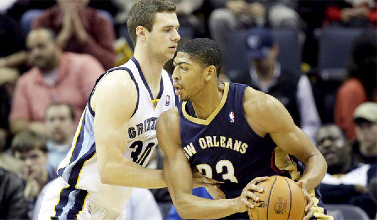Anthony Davis, right, collected 18 points, nine rebounds and three blocks for the Pelicans in New Orleans' 99-84 win over the Memphis Grizzlies on Wednesday.
