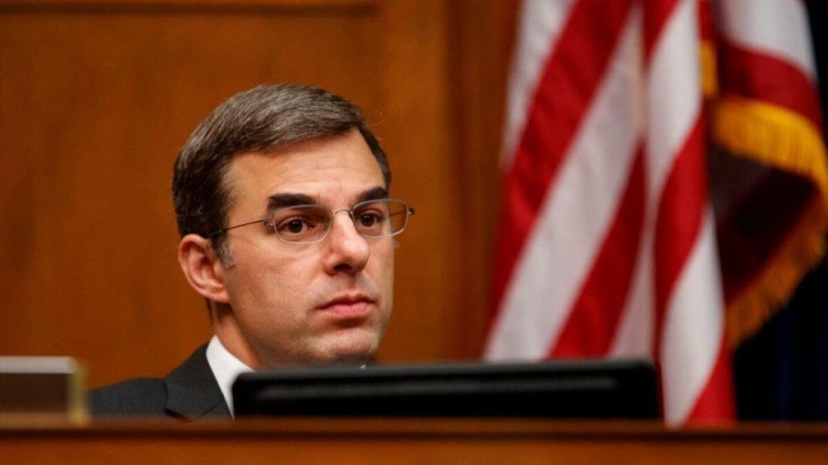 Rep. Justin Amash (R-Mich.) attends a congressional committee hearing in Washington on Wednesday, during a break from tweeting about President Trump.