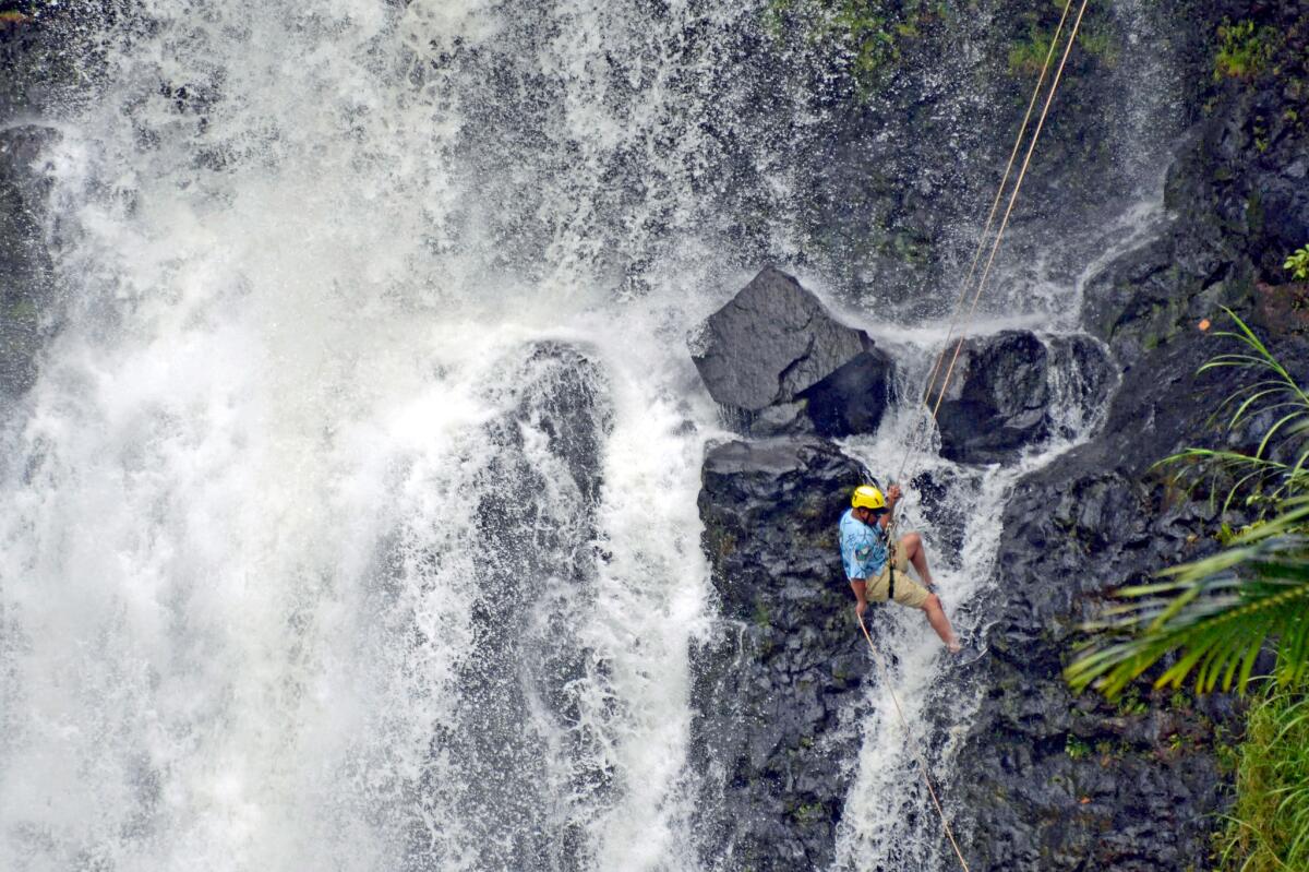 A military veteran rappels down Kulaniapia Falls, on the property of the Inn at Kulaniapia about three miles from Hilo on Hawaii Island.