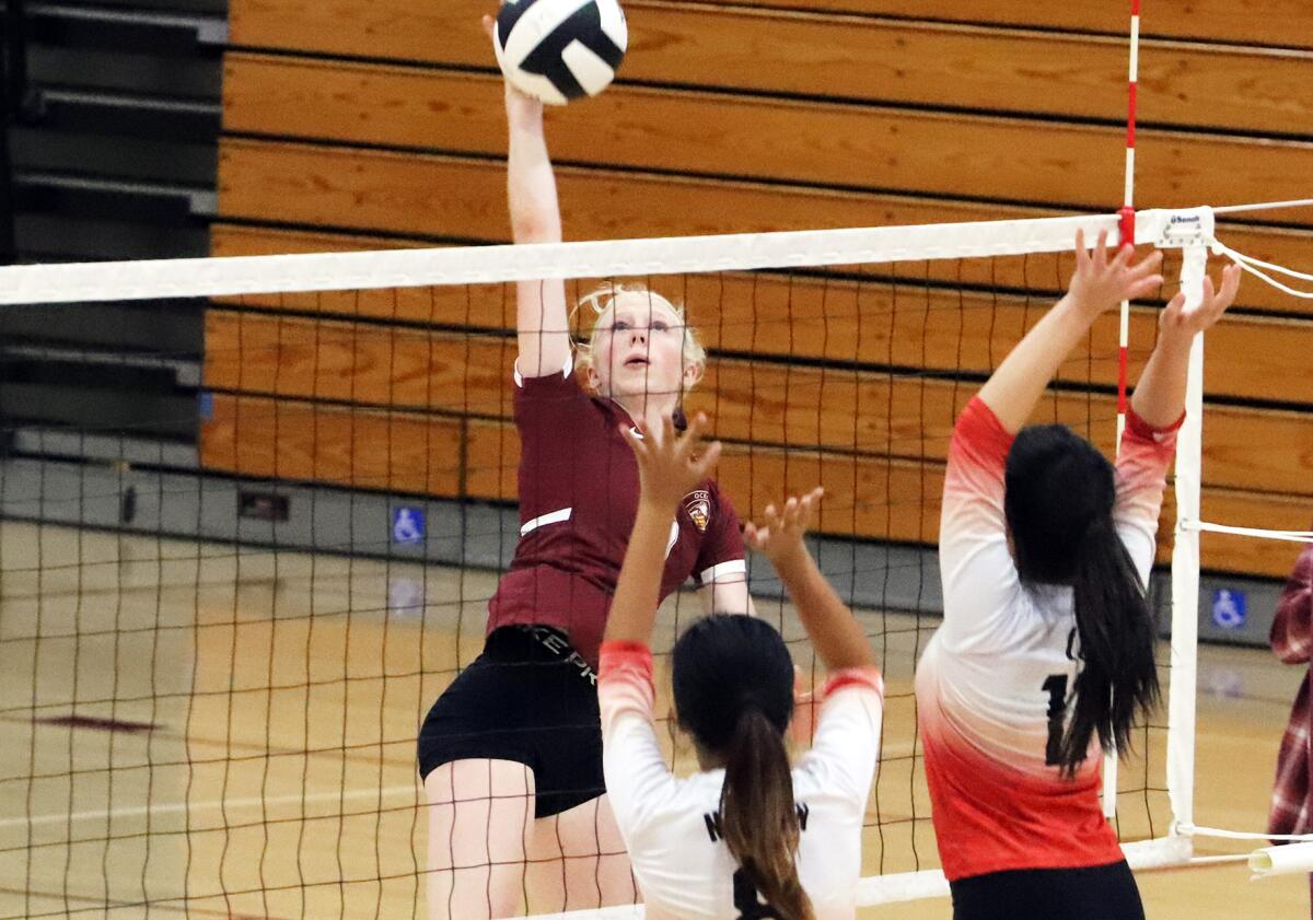 Ocean View's Sara Ligman (9) spikes the ball against Westminster in a Golden West League match on Wednesday.