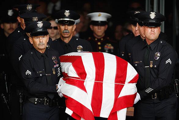 The funeral service for LAPD Officer Robert J. Cottle, killed March 24 in Afghanistan while on Marine Reserve duty, is held at the Cathedral of Our Lady of the Angels in Los Angeles. See full story