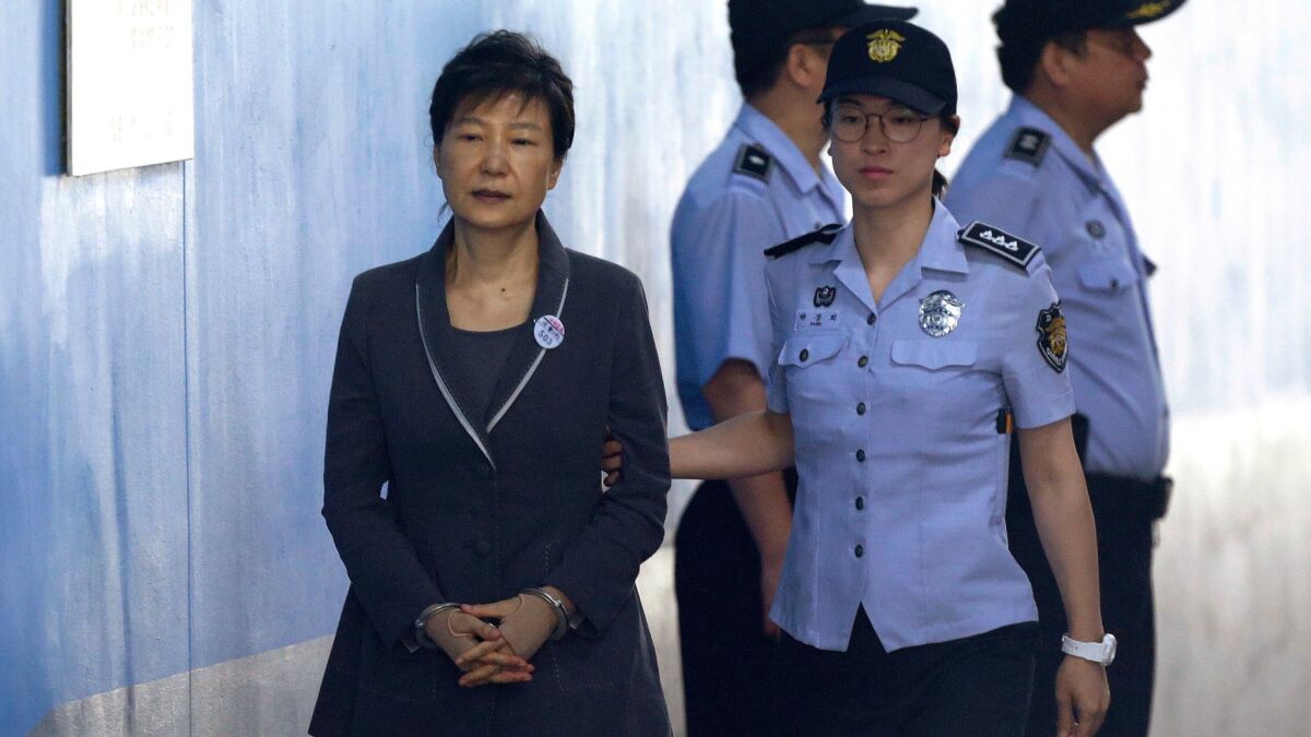 Former South Korean President Park Geun-hye is shown on her way to a court appearance in August 2017. She refused to participate in a yearlong trial.
