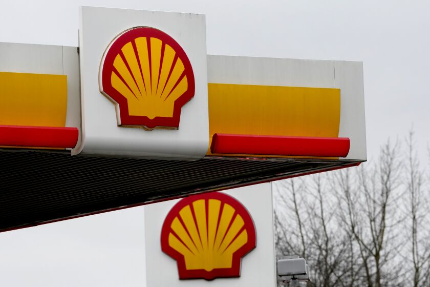 Signs at a shell petrol station in London, Thursday, Feb. 2, 2023. Global energy giant Shell says annual profits doubled to a record high last year as oil and gas prices soared after Russia's invasion of Ukraine. London-based Shell Plc on Thursday posted adjusted earnings of $39.9 billion for 2022 and $9.8 billion in the fourth quarter. (AP Photo/Kirsty Wigglesworth)
