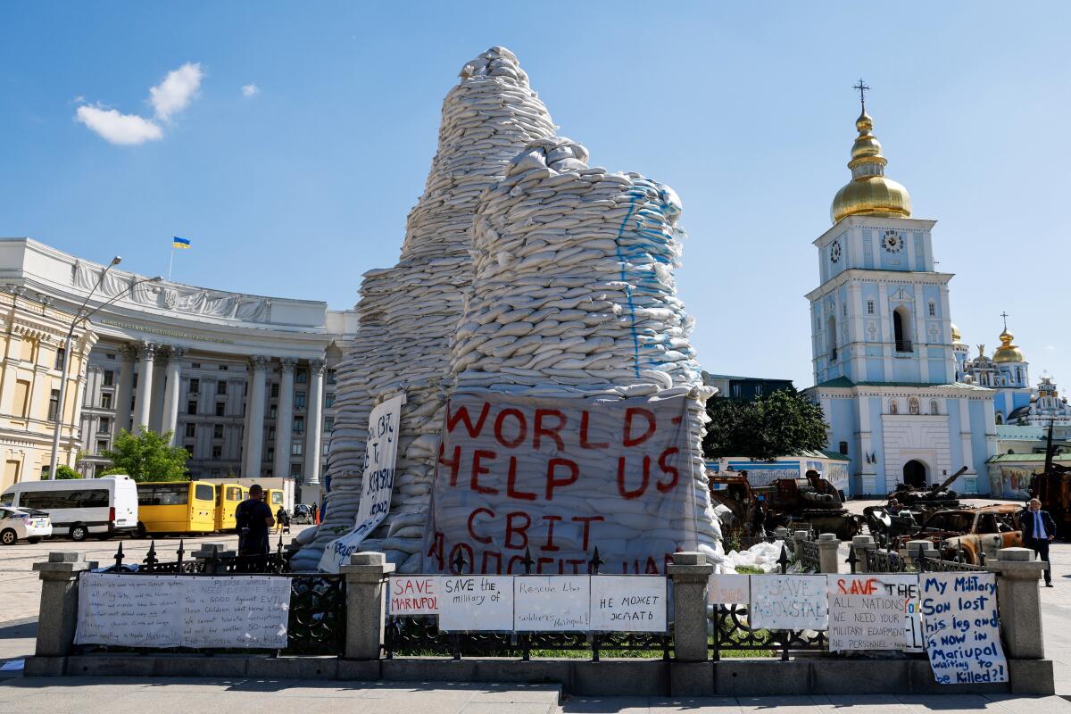 Sandbags protecting a monument in Kyiv.