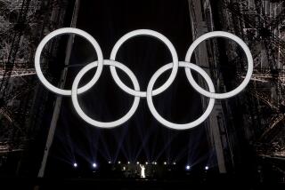 PARIS, FRANCE JULY 26, 2024 - Canadian singer Celine Dion performs on the Eiffel Tower as the Olympic rings are illuminated during the opening ceremony of the 2024 Summer Olympics in Paris, France Friday, July 26, 2024. (Wally Skalij/Los Angeles Times)