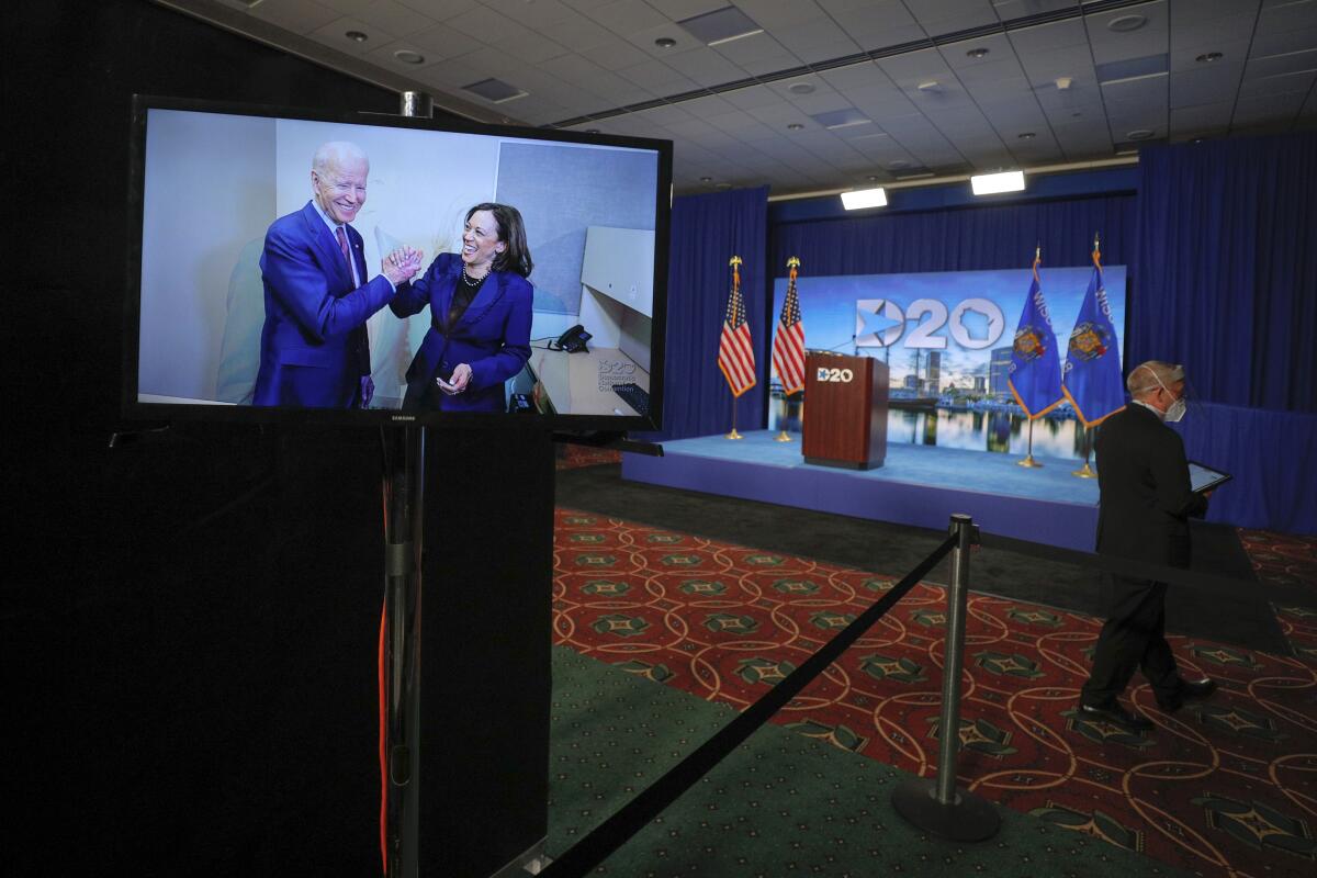 Joe Biden and his running mate Sen. Kamala Harris, D-Calif., appear on a video feed.