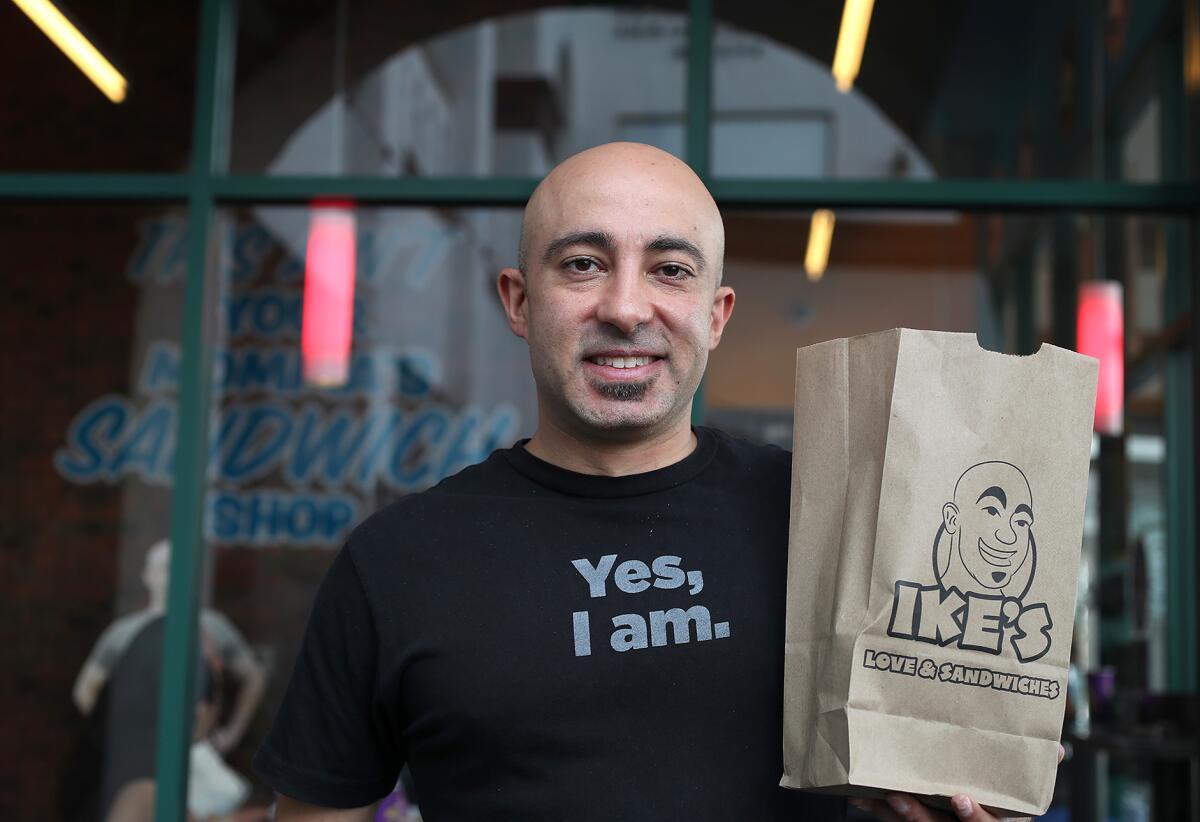 Owner-founder Ike Shehadeh during the grand opening of  Ike's Love and Sandwiches on Costa Mesa's Newport Boulevard Friday. 