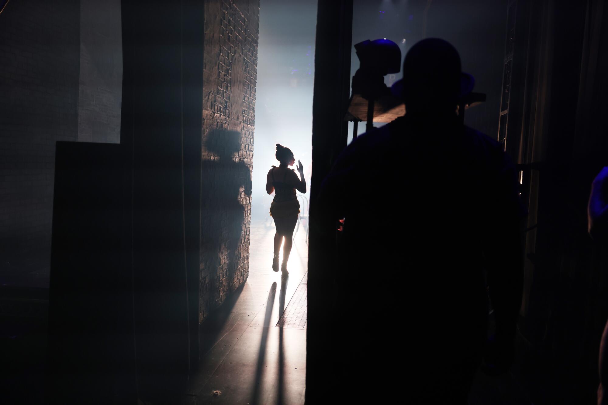 An actors walks on stage to perform during the musical adaptation of "Moulin Rouge!" at Pantages Theater.