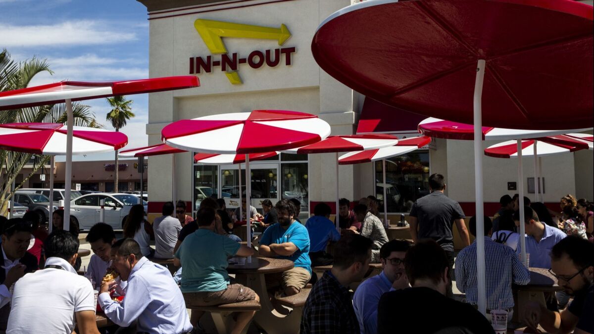 LOS ANGELES, HI - AUGUST 30: People pack the In-N-Out Burger for the lunch rush, on Thursday, Aug. 30, 2018 in Los Angeles, HI. GOP opponents are calling for the boycott of the popular fast food chain for donating thousands of dollars to the California state Republican Party. (Kent Nishimura / Los Angeles Times)