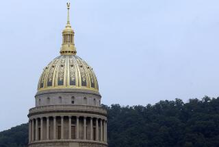 West Virginia's newly refinished Capitol dome is shown Friday, Oct.1 4, 2005, in Charleston, W.Va. County education boards in West Virginia could contract with military veterans and retired law enforcement officers to provide armed security at K-12 public schools under a bill passed by the Republican-controlled state Senate. (AP Photo/Jeff Gentner, File)