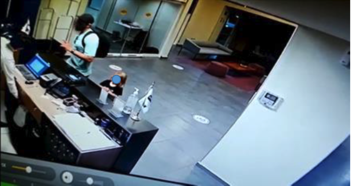 Matthew Taylor is seen in surveillance video checking into a hotel his 3-year-old daughter