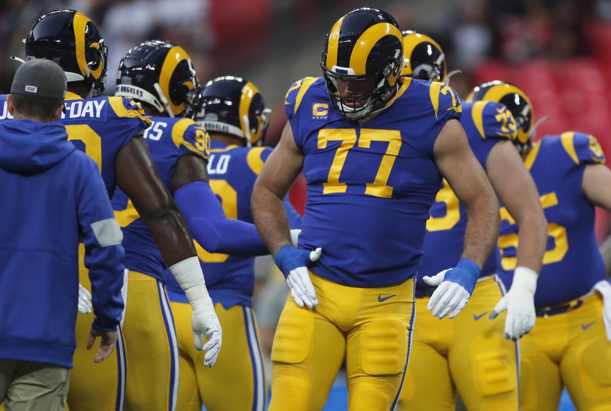 Rams offensive tackle Andrew Whitworth (77) warms up with teammates before playing against the Bengals, his former team, for the first time.