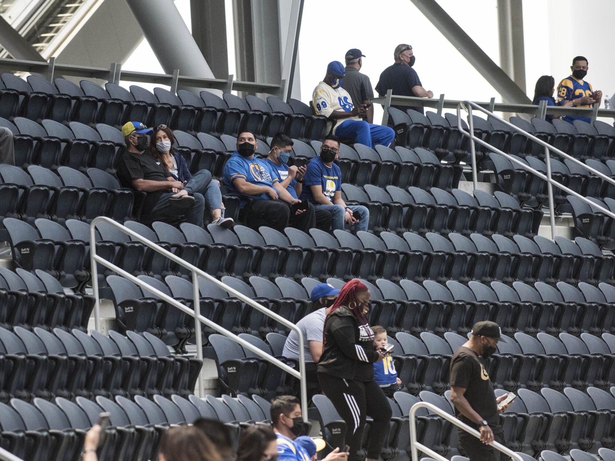 Rams season ticket holders sit in their seats for the first time at SoFi Stadium in Inglewood on Saturday.