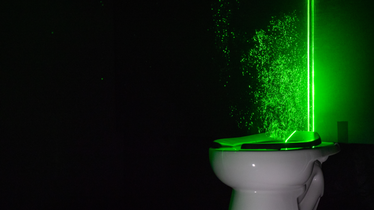 Green lasers reveal you should close the toilet lid before you flush