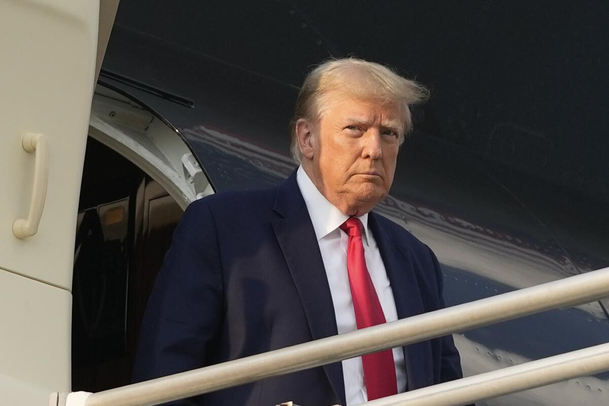 Former President Trump steps off his plane 