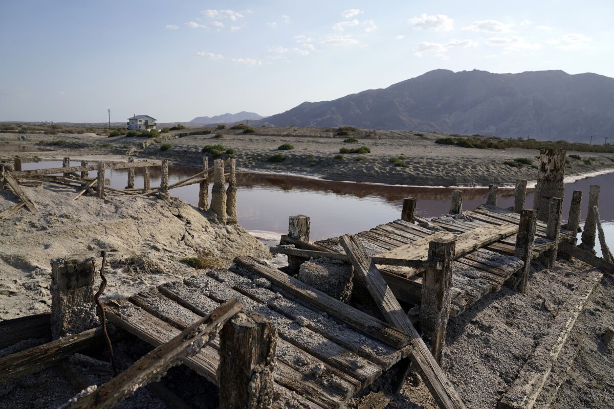 The remains of an abandoned boating dock are seen at a dried-up area of the Salton Sea in July 2021.