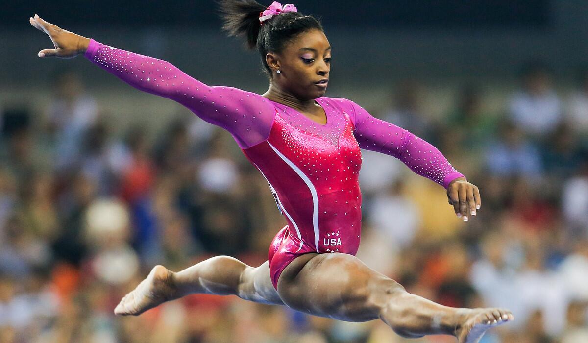 Simone Biles performs her routine on the balance beam during the the world gymnastics championships on Friday.