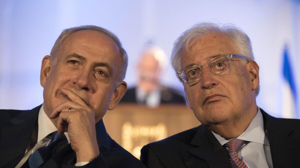 Israeli Prime Minister Benjamin Netanyahu, left, and U.S. Ambassador to Israel David Friedman attend a ceremony in Jerusalem on May 21, 2017, marking the 50th anniversary of the 1967 Middle East War.