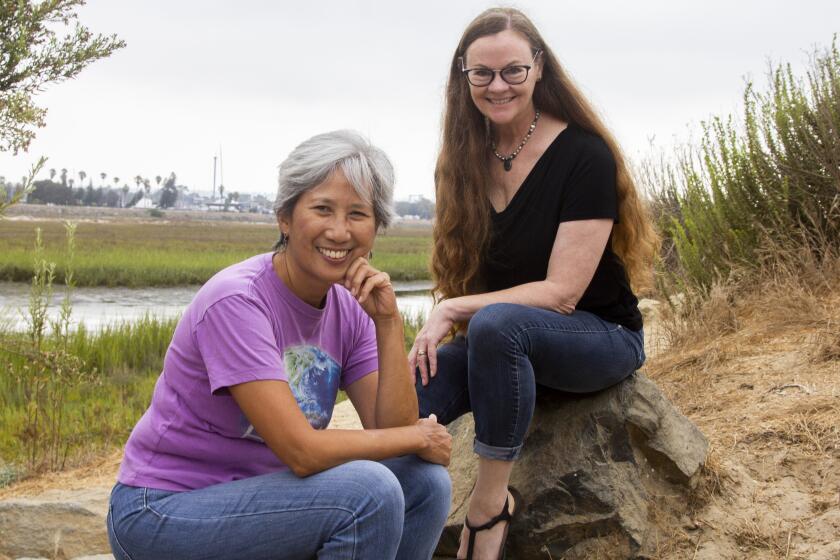 San Diego, CA - August 10: Thelma Virata de Castro and Cecelia Kouma of the Playwrights Project at Dog Beach, in San Diego, CA. (Brittany Cruz-Fejeran / The San Diego Union-Tribune)