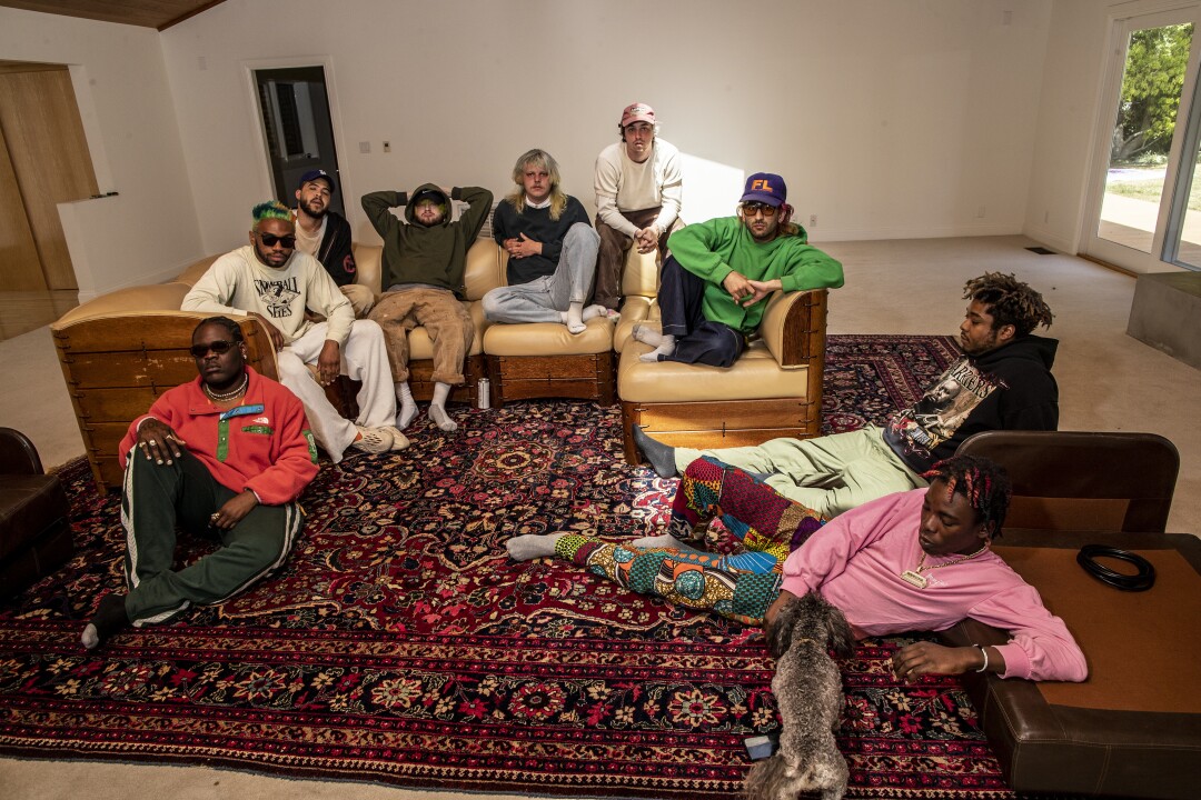 Brockhampton members sit around and relax.